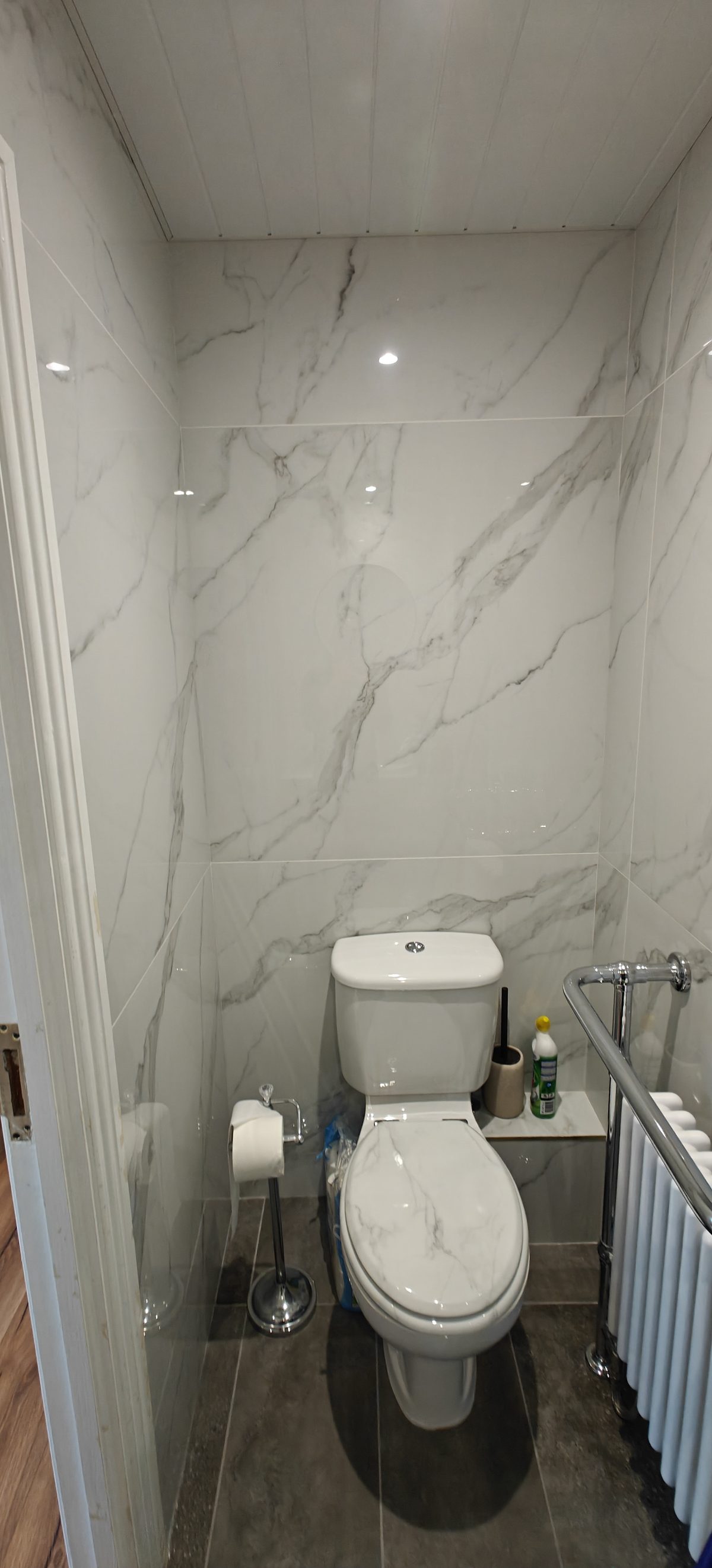 Marble effect toilet with chrome towel radiator